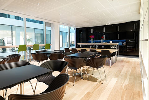 a photo of a breakout area with modern layout and wood flooring