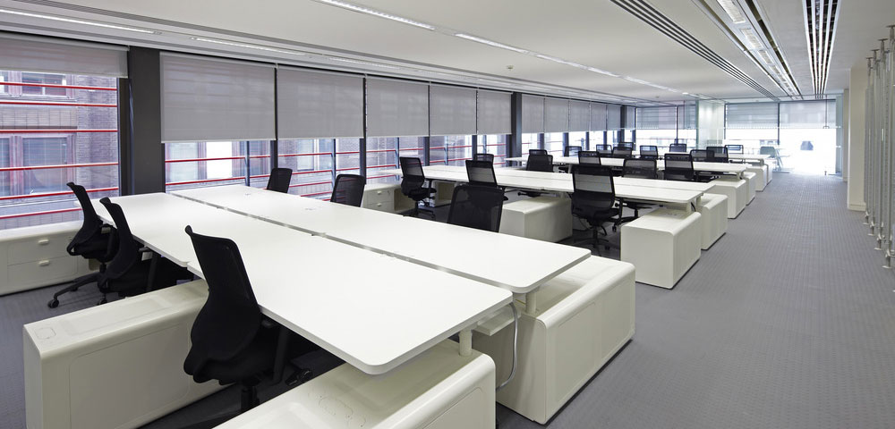 Photo of contemporary open plan office with roller blids