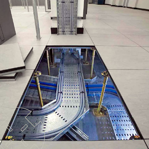 A photo showing raised flooring with cable conduits visible